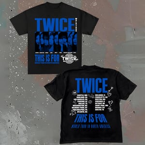 May include: Black t-shirts with blue text and graphics. The front of the shirt says "TWICE" and "THIS IS FOR" with images of the band members. The back lists North American tour cities.