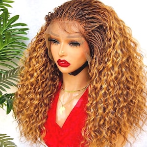 May include: A braided wig with a lace front features a blend of light brown and golden blonde micro braids. The wig has long, curly, golden blonde hair. The model is wearing a red top and gold jewelry.