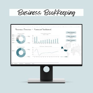 May include: A computer screen displaying a business bookkeeping dashboard with charts and graphs. The dashboard shows income and expenses by category and month, as well as total revenue, income, and expenses. The dashboard also includes a map of the world.
