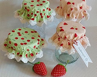 Jam jar cover with crochet edge, strawberry or cherry.