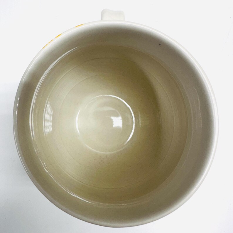May include: A trio of ceramic mugs with a speckled, matte finish in cream, light grey, and dark grey. Each mug features a simple, minimalist design, ideal for tea or coffee.