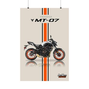 May include: A white and black Yamaha MT-07 motorcycle with orange accents. The motorcycle is on a beige background with black and orange stripes. The text "YAMAHA MT-07" is above the motorcycle. The text "AceMoto Drawings" is below the motorcycle.