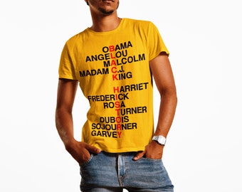 May include: A yellow t-shirt with the words "BLACK HISTORY" spelled out vertically using the names of prominent African Americans. The names include: Obama, Angelou, Malcolm, C.J. King, Madam, Harriet, Frederick, Rosa, Turner, Dubois, Sojourner, and Garvey.