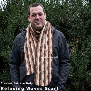 May include: A crochet scarf pattern for a relaxing waves scarf. The scarf is made with brown and white yarn and has a wavy pattern.