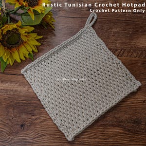 May include: A beige crocheted hotpad with a loop handle. The hotpad is made with a Tunisian crochet stitch and has a rustic look.