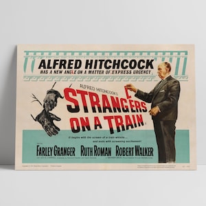 May include: A vintage movie poster for the film "Strangers on a Train" directed by Alfred Hitchcock. The poster features a red and black title with a train track design. The poster also features a photo of a man in a suit holding a match and a pair of gloved hands reaching out from the side of the poster.