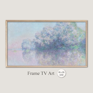 May include: A framed painting of a landscape with a river and trees. The trees are a light blue and purple color, and the river is a light pink color. The sky is a light blue color. The painting is in a wooden frame.