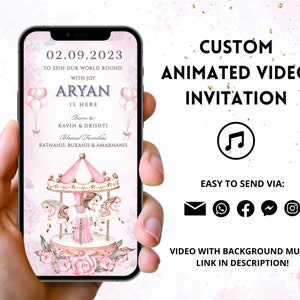 May include: A smartphone screen shows a custom animated video invitation. The design includes a carousel with pink and white horses, floral details, and the text "ARYAN IS HERE." The invitation also displays the date, names, and social media icons.