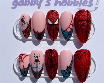 unhas azul e vermelho olho de gato aranha