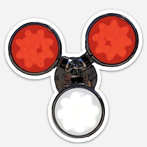 May include: A three-pronged, silver-colored device with three red, circular lights. Each light has a black, gear-like design in the center. The device has a black, textured surface and a silver, circular, gear-like design in the center.