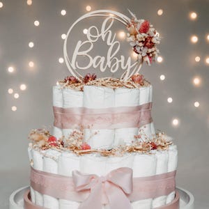 Diaper cake in soft pink for girls