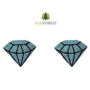 May include: Two blue diamond-shaped rugs with black outlines. The rugs are on a white background.