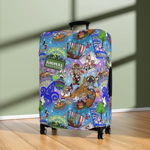 May include: A blue suitcase cover with a vibrant design of cartoon characters and theme park attractions. The cover displays the text "Animal Kingdom" and other park-related imagery. The suitcase has a black handle and wheels.