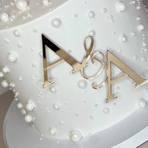 May include: A set of three ceramic mugs with a speckled, matte finish. The mugs are in shades of cream, light gray, and dark gray. Each mug has a simple, minimalist design, perfect for coffee or tea.