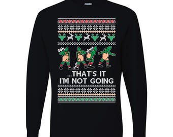 May include: Black long-sleeve shirt with a festive Christmas sweater design. The design includes green dancing dinosaur figures, reindeer, snowflakes, and the text "...THAT'S IT I'M NOT GOING".