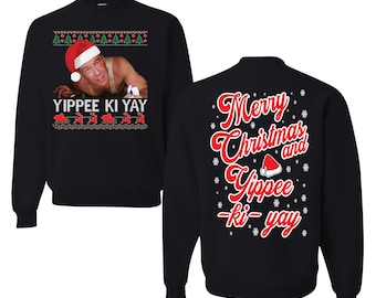 May include: Black sweatshirt with a festive design. The front features a holiday-themed image with the text "Yippee Ki Yay". The back of the sweatshirt says "Merry Christmas and Yippee Ki-yay" in red script with snowflakes and a Santa hat.