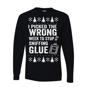May include: Black long-sleeve shirt with white text that reads "I picked the wrong week to stop sniffing glue." The shirt has a graphic of a glue bottle and snowflake and Christmas tree designs.