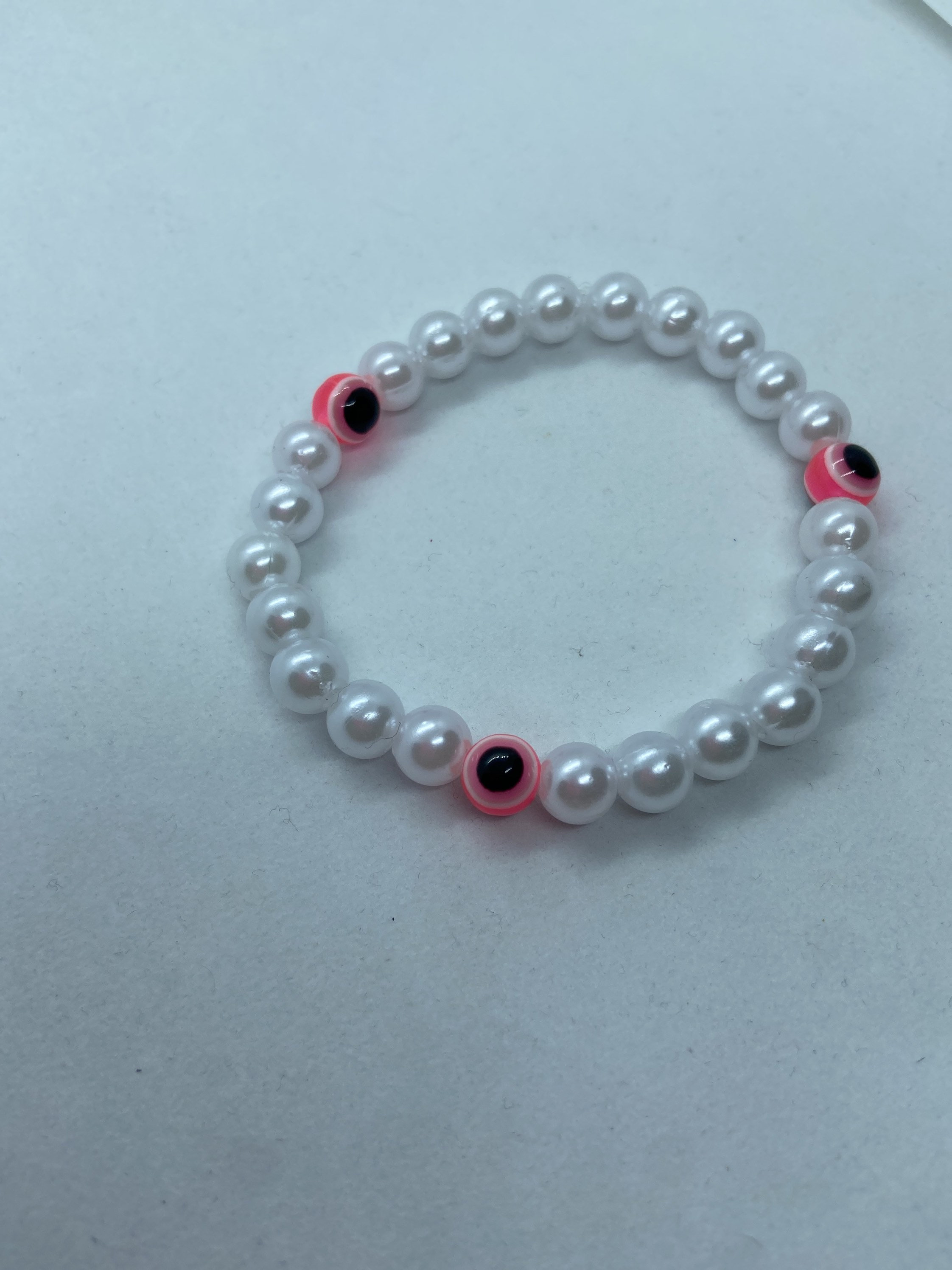 Hot pink evil eye bracelet with faux pearls Etsy