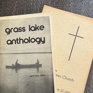 May include: A set of three ceramic vases in varying heights and shapes. The vases are glazed in a matte white finish, offering a minimalist aesthetic. The tallest vase is approximately 10 inches high.