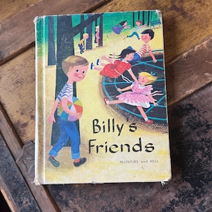 May include: A vintage hardcover book titled Billy's Friends by McIntire and Hill. The cover features a colorful illustration of a boy holding a striped ball in the foreground, with other children playing on a merry-go-round in the background.