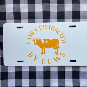 Easily distracted by cows funny front license plate | car tag | vanity plate | front license plate | cute car tag | funny car tag