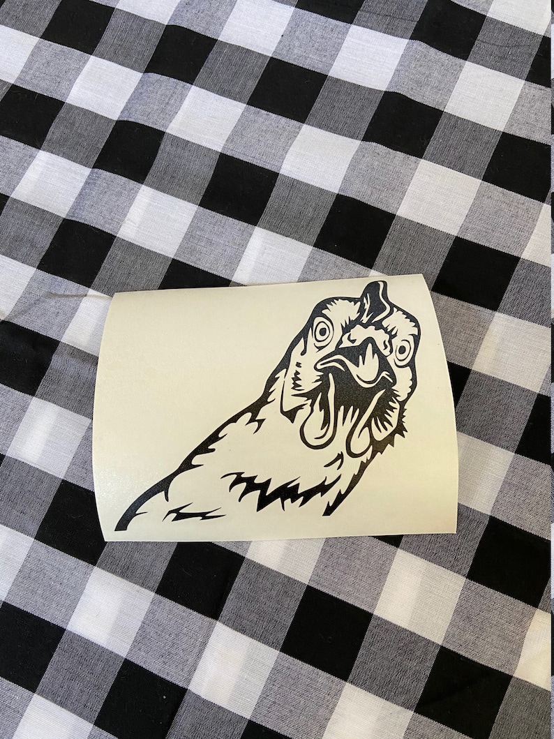 May include: Black and white vinyl decal of a chicken's head with its beak open. The chicken is looking to the left of the image.