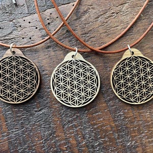 Flower of life pendant in walnut, maple or oak. Customizable cord length.