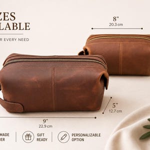 May include: Two brown leather wash bags, one large (22.9cm x 12.7cm x 12.7cm) and one standard (20.3cm x 10.2cm x 10.2cm). Both have a zip closure and a handle. The image includes text indicating handmade leather and a customizable option.