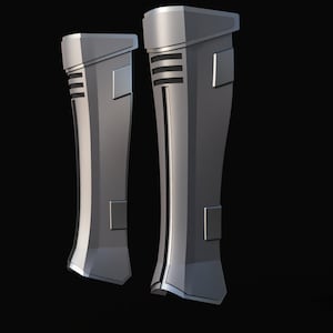 May include: A pair of silver-colored, futuristic-looking boots with a textured design. The boots have a sleek, modern look and are made of a durable material.