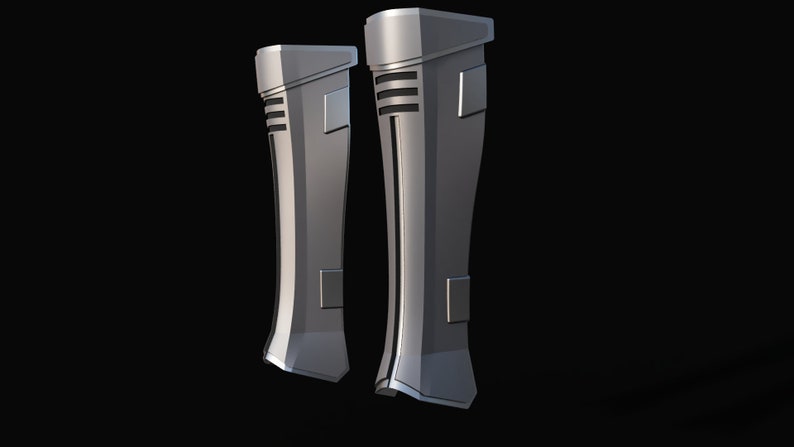 May include: A pair of silver-colored, futuristic-looking boots with a textured design. The boots have a sleek, modern look and are made of a durable material.