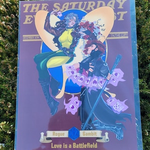Pode incluir: Uma capa de banda desenhada com Rogue e Gambit em poses dinâmicas. A arte apresenta um design em forma de coração e o título "The Saturday Event". O texto "Love is a Battlefield" está na parte inferior da capa, com a data "12 de dezembro".