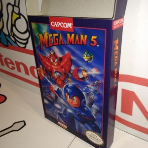 May include: A blue and purple box for the Mega Man 5 video game for the Super Nintendo Entertainment System. The box features a cartoon image of Mega Man flying through the air with a red robot in the background. The text "CAPCOM" and "MEGA MAN 5" are printed on the box.