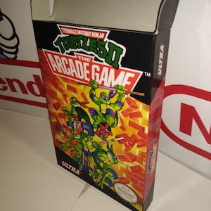 May include: A Teenage Mutant Ninja Turtles II: The Arcade Game box for the Nintendo Entertainment System. The box is red, black, and yellow with an image of the four turtles fighting on a brick background. The box is labeled "Ultra" and has the Nintendo Seal of Quality.