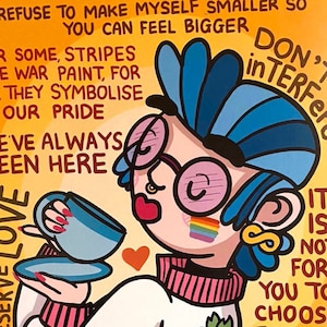 May include: A colourful illustration on a yellow background. It depicts a cartoon character with blue hair, glasses, and a rainbow flag. The artwork includes text about pride and self-acceptance, with a cup and saucer in the character's hand. The words "I DESERVE LOVE" are also visible.