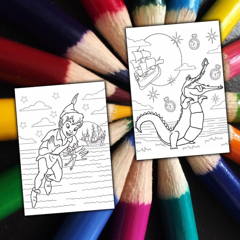 May include: Two black and white coloring pages featuring scenes from Peter Pan. One shows Peter Pan, a ship, and the sea. The other depicts a crocodile, a ship, and a moon. The pages are surrounded by a colorful array of sharpened colored pencils.