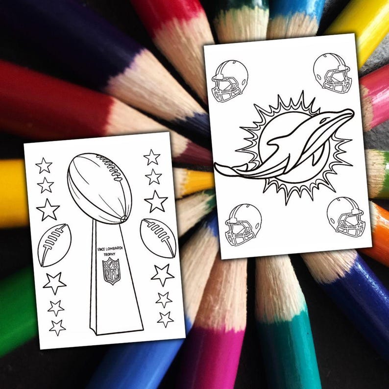 May include: Two white colouring pages with football-themed designs. One shows the Vince Lombardi Trophy, footballs, and stars. The other features a dolphin logo and football helmets. The pages are surrounded by a colourful array of sharpened coloured pencils.