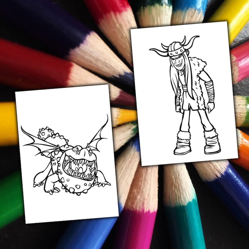 May include: Two white cards featuring black line drawings of characters from "How to Train Your Dragon". One shows a dragon, the other a Viking character. The cards are set against a backdrop of a fan of coloured pencils.