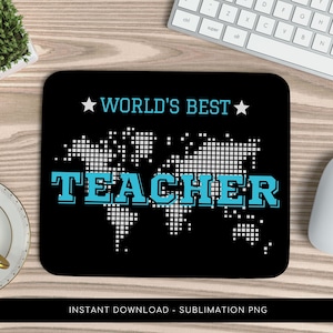 May include: Black mousepad with the text "WORLD'S BEST TEACHER" in blue and white, with a world map design. The mousepad is rectangular and sits on a wooden desk next to a keyboard and mouse.