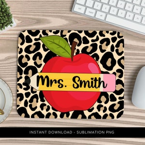 May include: A sublimation design featuring a red apple with a yellow pencil that says "Mrs. Smith" on a leopard print background.