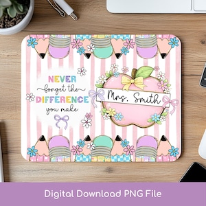 May include: A rectangular mouse mat with a pink and white striped background. The design features colourful pencils, flowers, and an apple with a bow. Text reads "Never forget the difference you make" and "Mrs. Smith."