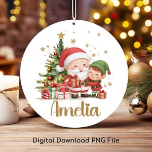 May include: Round Christmas ornament featuring Santa Claus and an elf hugging, with a Christmas tree and gifts. The name "Amelia" is written in gold script. The ornament has a white background with gold stars. Text at the bottom reads "Digital Download PNG File."