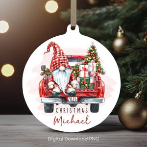 May include: A red truck with a gnome sitting in the back. The truck is filled with presents and a Christmas tree. The ornament is personalized with the text "2024 Christmas Michael".