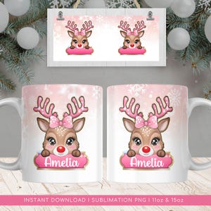 May include: Pink sublimation design for a 11oz or 15oz mug featuring a cartoon reindeer with a pink bow and the name Amelia. The design is on a pink background with white snowflakes.