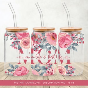 May include: Three 16 ounce glass jars with bamboo lids and clear straws. Each jar has a floral design with pink and grey flowers and the text "mom life best life" in pink.