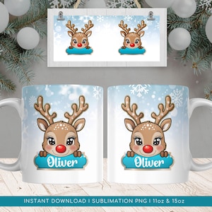 May include: White ceramic mug with a blue and white winter scene background. A cartoon reindeer with a red nose is peeking over a blue banner with the name "Oliver" in gold lettering. The mug is 11 oz or 15 oz.