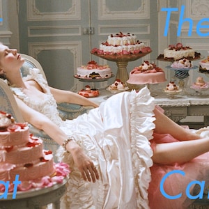 May include: A woman in a white dress and pink petticoat reclines on a blue chaise lounge. She is surrounded by a table full of pink and white cakes with various toppings. The text "Let Them Eat Cake" is written in blue letters across the image.