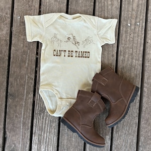 Can&#39;t Be Tamed Rodeo Horse Infant Bodysuit, Country Western Beige Baby Bodysuit, Bucking Horse Design, Cowboy, Cowgirl, Baby Shower Gift