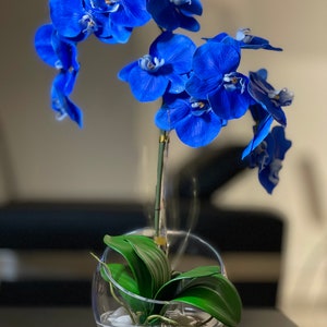 Blue Orchids Centerpiece in a Cut Glass Vase