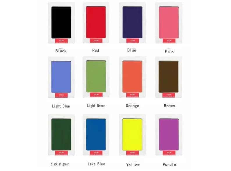 May include: Twelve ink pads in a white frame, each showing a different color: black, red, blue, pink, light blue, light green, orange, brown, dark green, lake blue, yellow, and purple.