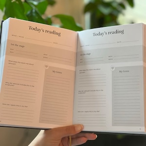 May include: An open journal with a black cover and white pages. The journal is titled "Today's Reading" and has sections for "Set the Stage" and "My Gems".
